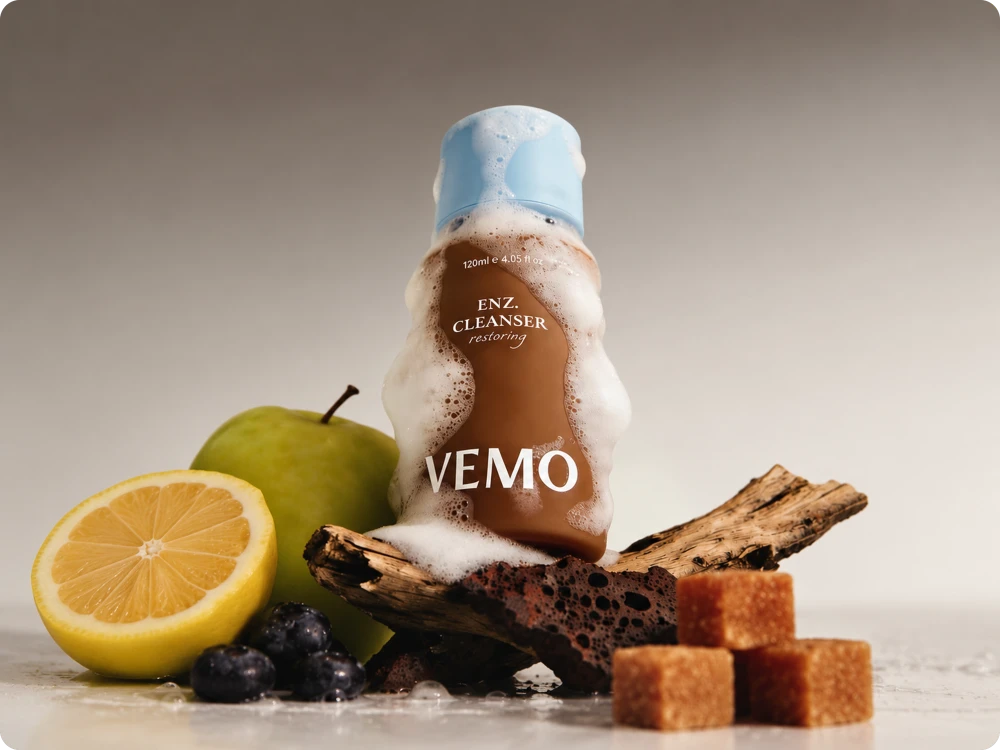 Expanded product photo with more space around the bottle and fruit